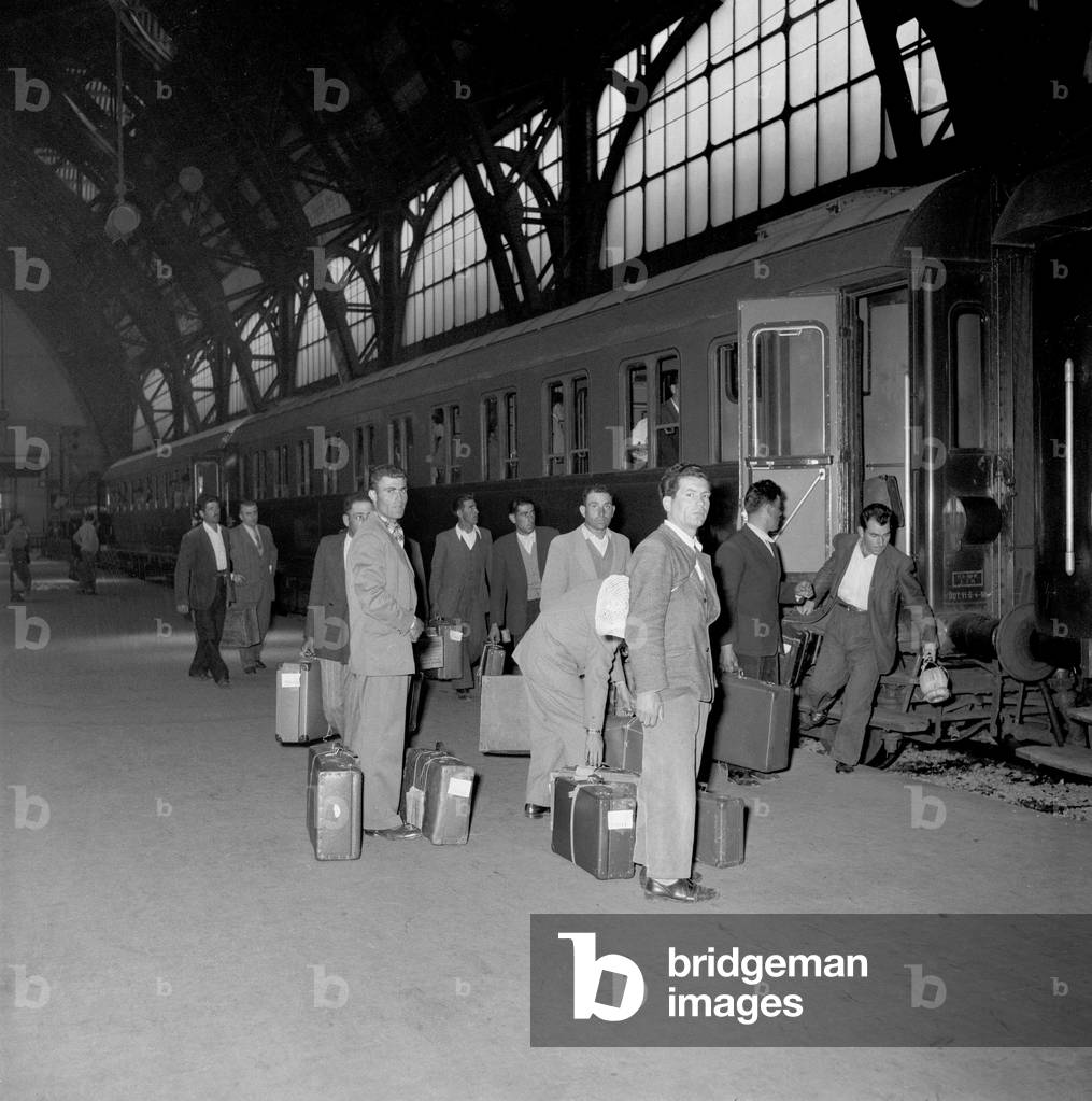 The departure of Italian emigrants for Belgium at the central station, Milan, 1955 (b/w photo)