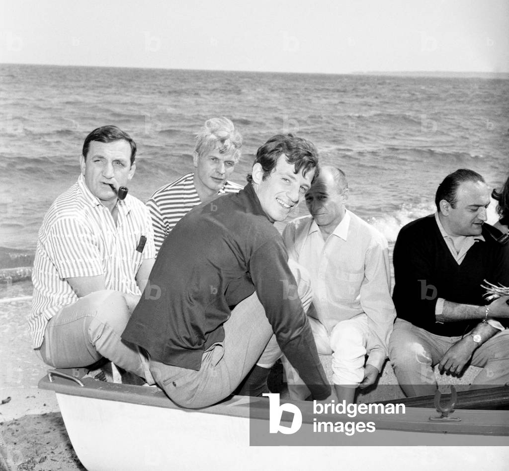 Cannes, mai 1964 from left to right Lino Ventura, Reginald Kernan, Jean Paul Belmondo, and director Henri Verneuil (b/w photo)