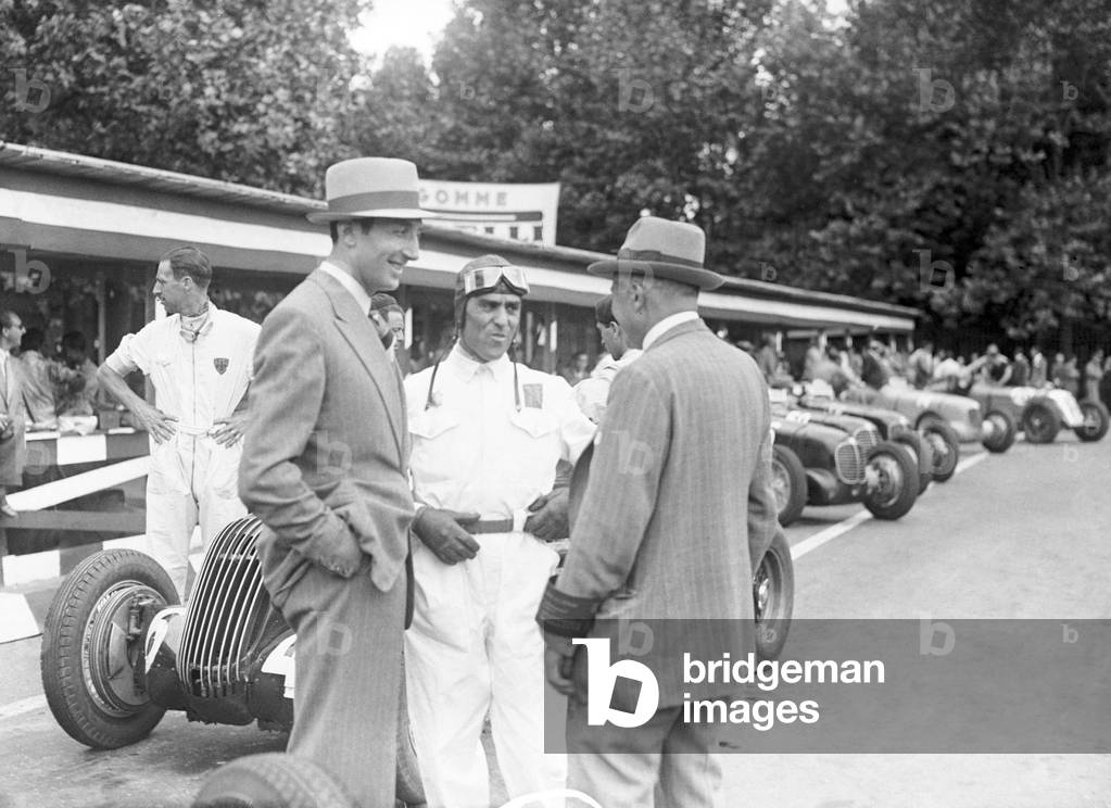 Tazio Nuvolari at the Grand prix automobile, Milan, Italy, 1937 (b/w photo)