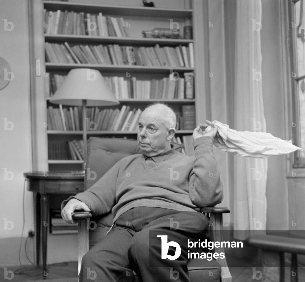 Jean Renoir at his home, Paris, 1957 (b/w photo)