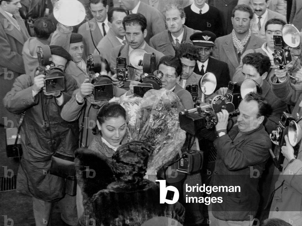 Ava Gardner surrounded by photographers and cameramen, Rome, 1954 (b/w photo)