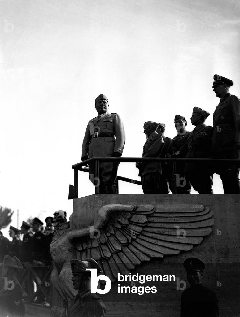 Benito Mussolini attends the parade of an army unit leaving for Russia in Villa Glori, Rome, 1941 (b/w photo)