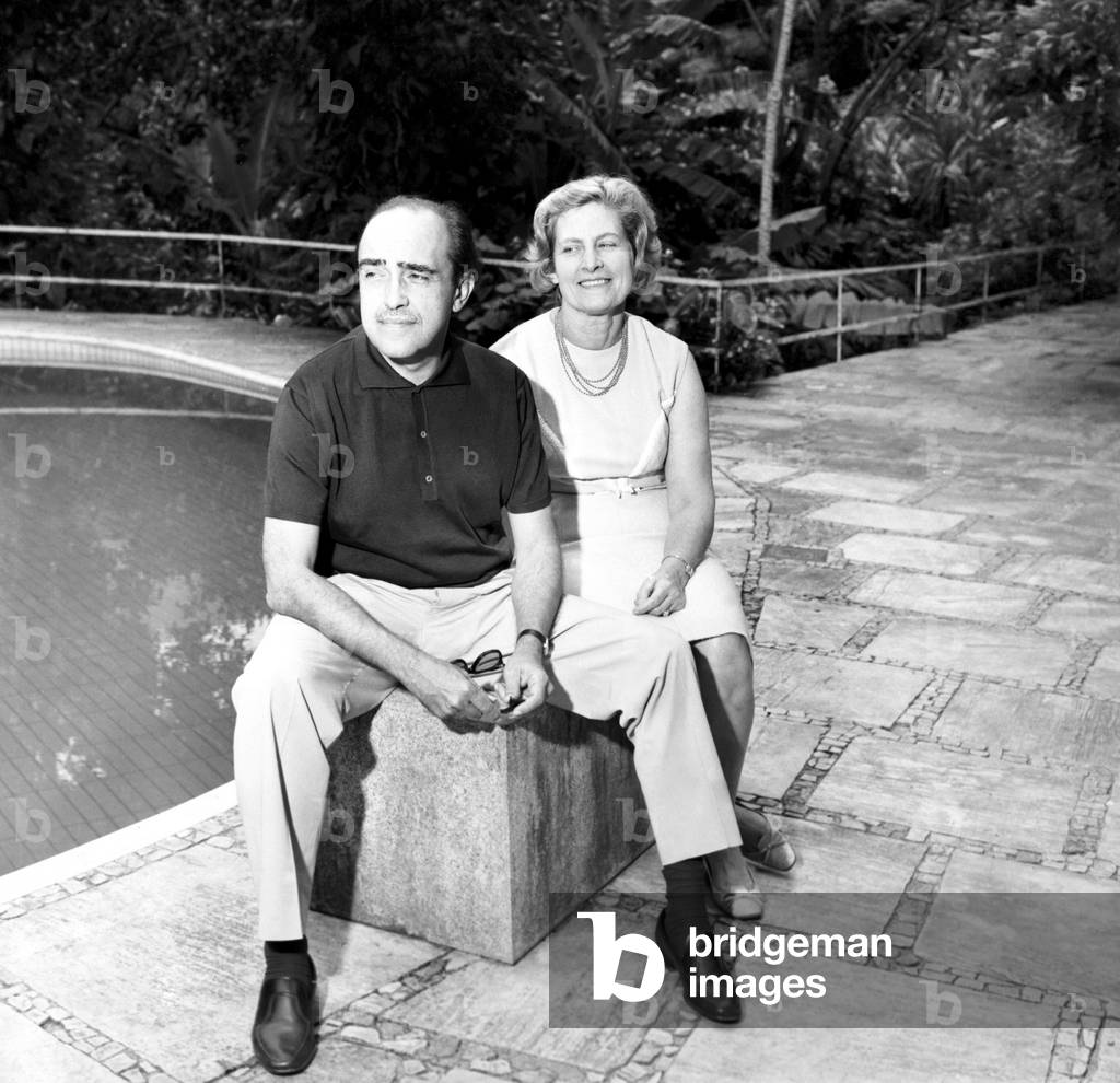 Oscar Niemeyer and his wife in his garden, in Canoas (Brazil) Jan 1965 (b/w photo)