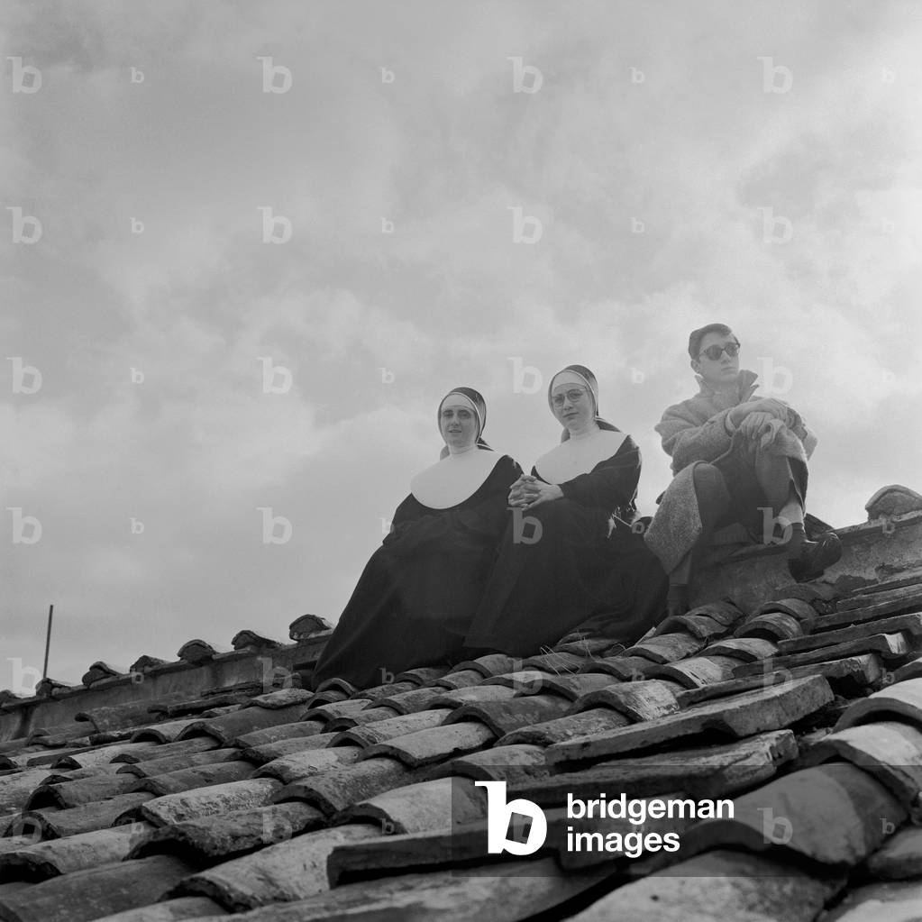 People on a rooftop awaiting the coronation of Pope John XXIII, Vatican City, 4th November 1958 (b/w photo)