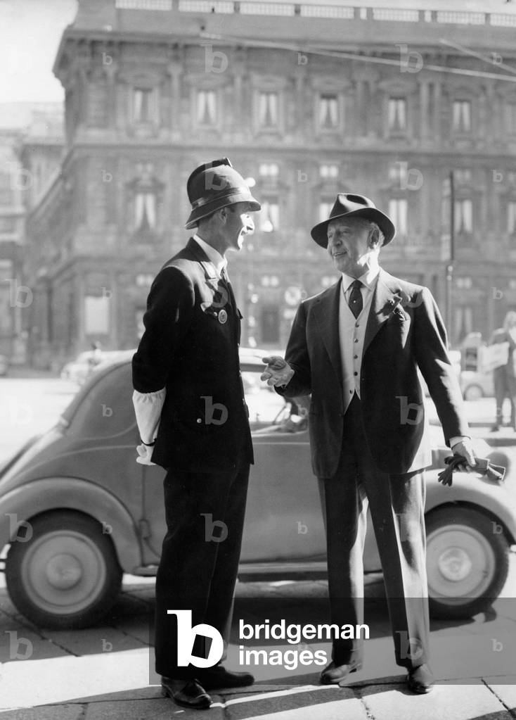 Arthur Rubinstein talking to a policeman, Milan, 1958 (b/w photo)