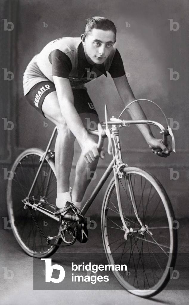 Fausto Coppi posing on his bicycle for a studio photograph, 1940 (b/w photo)