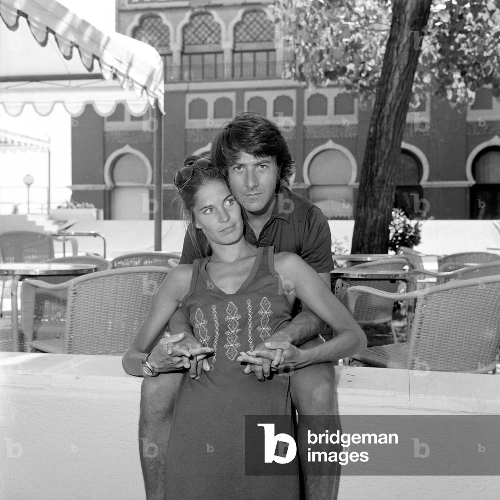 Dustin Hoffman hugging his wife Anne Birne at Venice Film Festival, 1972 (b/w photo)