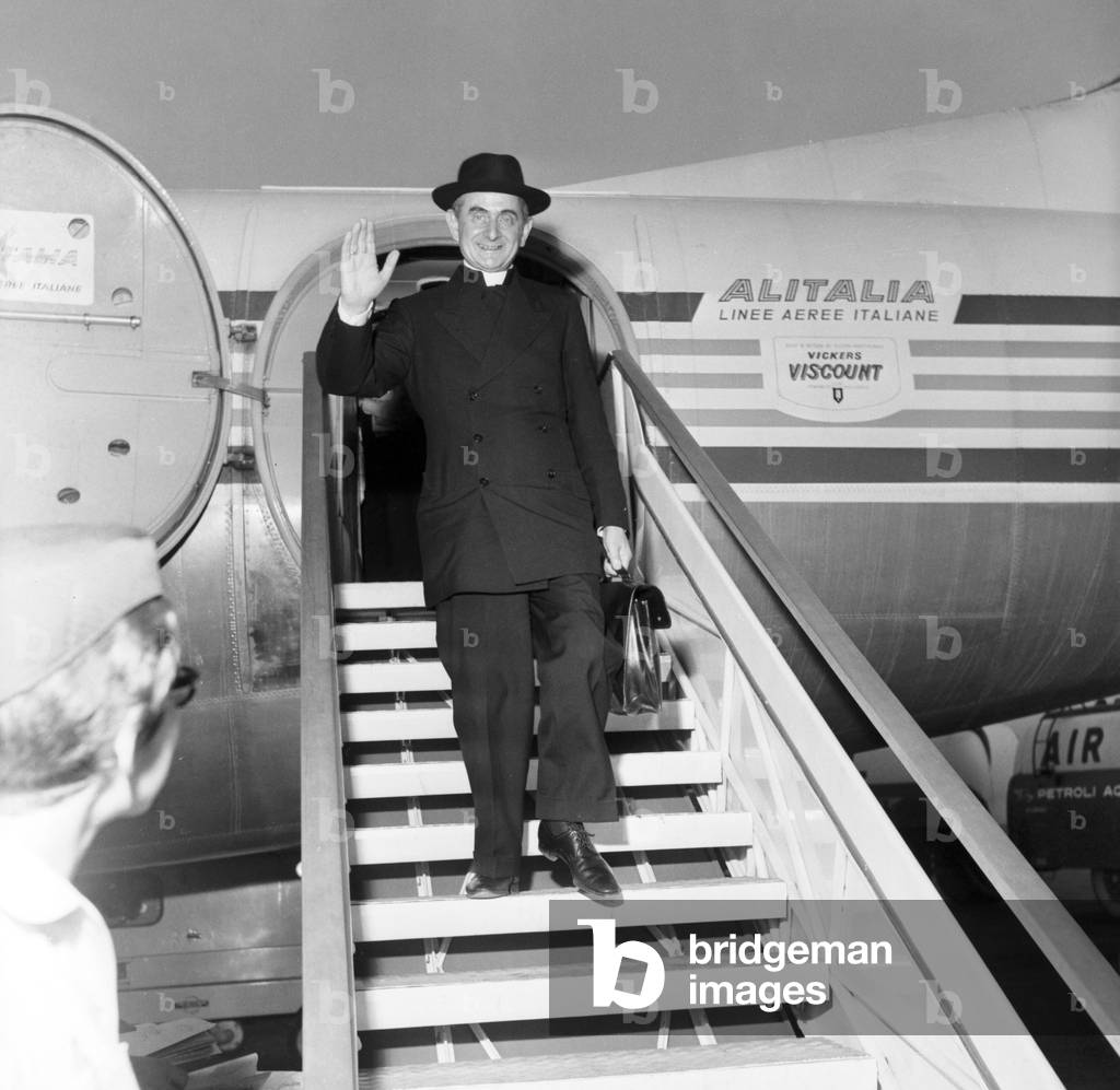 Giovanni Battista Montini as archibishop of Milan, returning from a trip to Africa, Milan, 1962 (b/w photo)
