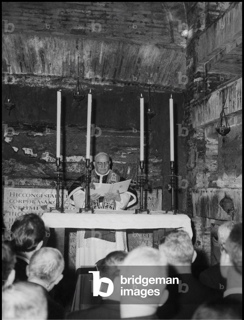 Pope John XXIII celebrating the Mass during a visit at the catacombs of St Callisto, Rome, 1961 (b/w photo)