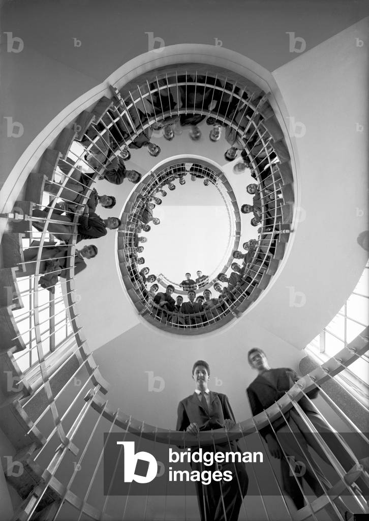 Students of the Lyceum Vittorio Veneto, posing in the stairwell, Milan, 1959 (b/w photo)