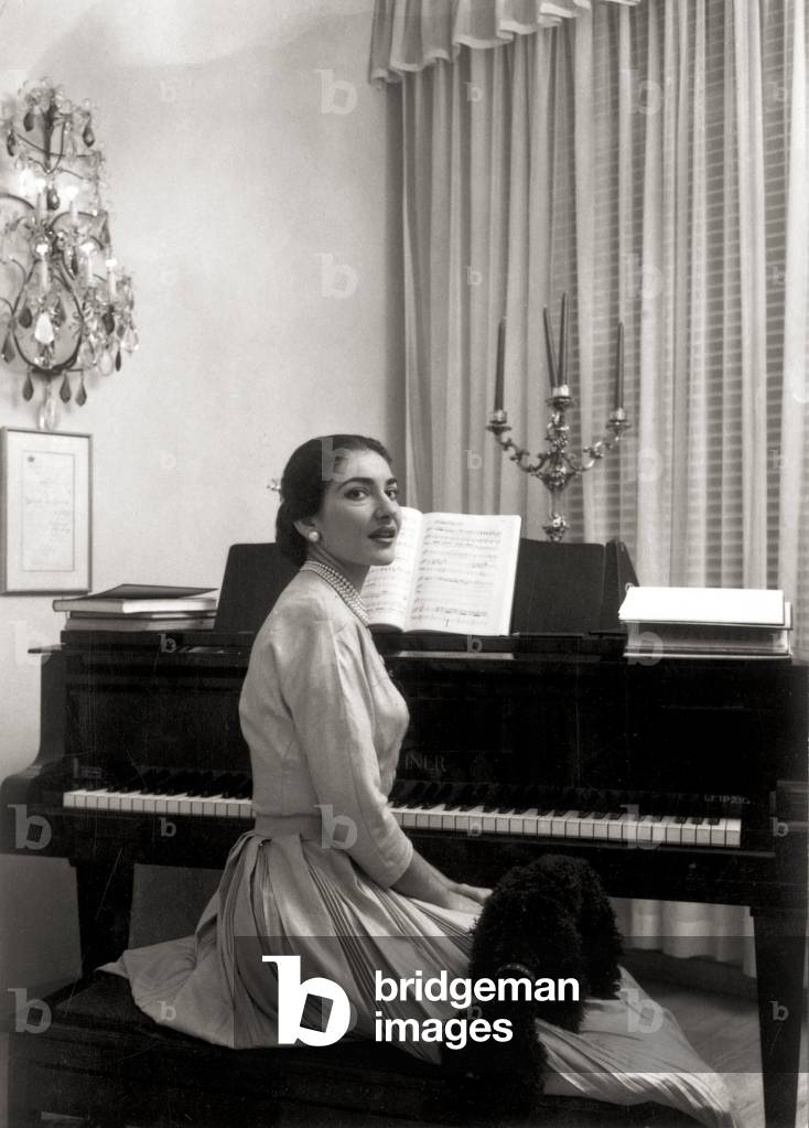 Maria Callas Meneghini in front of her piano at home, Milan, 1957