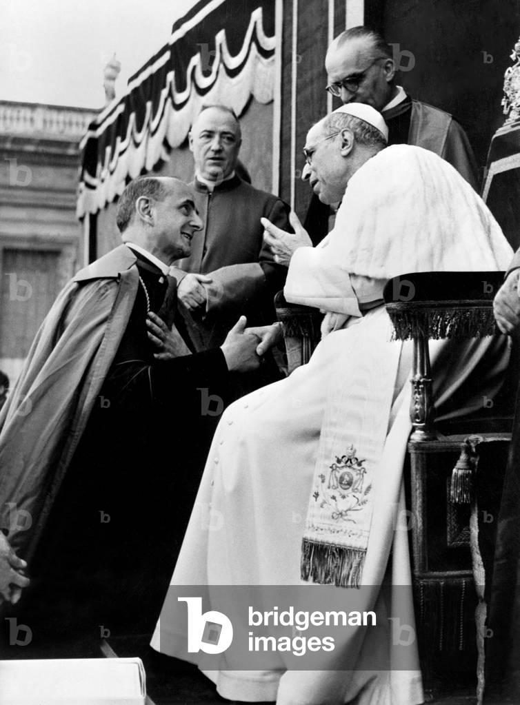 Pope Pius XII talking to the Archbishop of Milan Giovanni Battista Montini, Rome, 1955 (b/w photo)