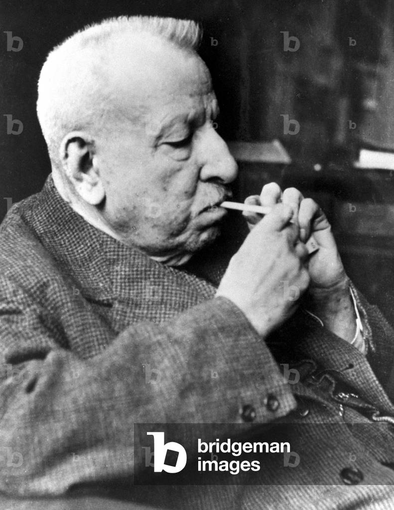 Benedetto Croce lighting a cigarette (b/w photo)