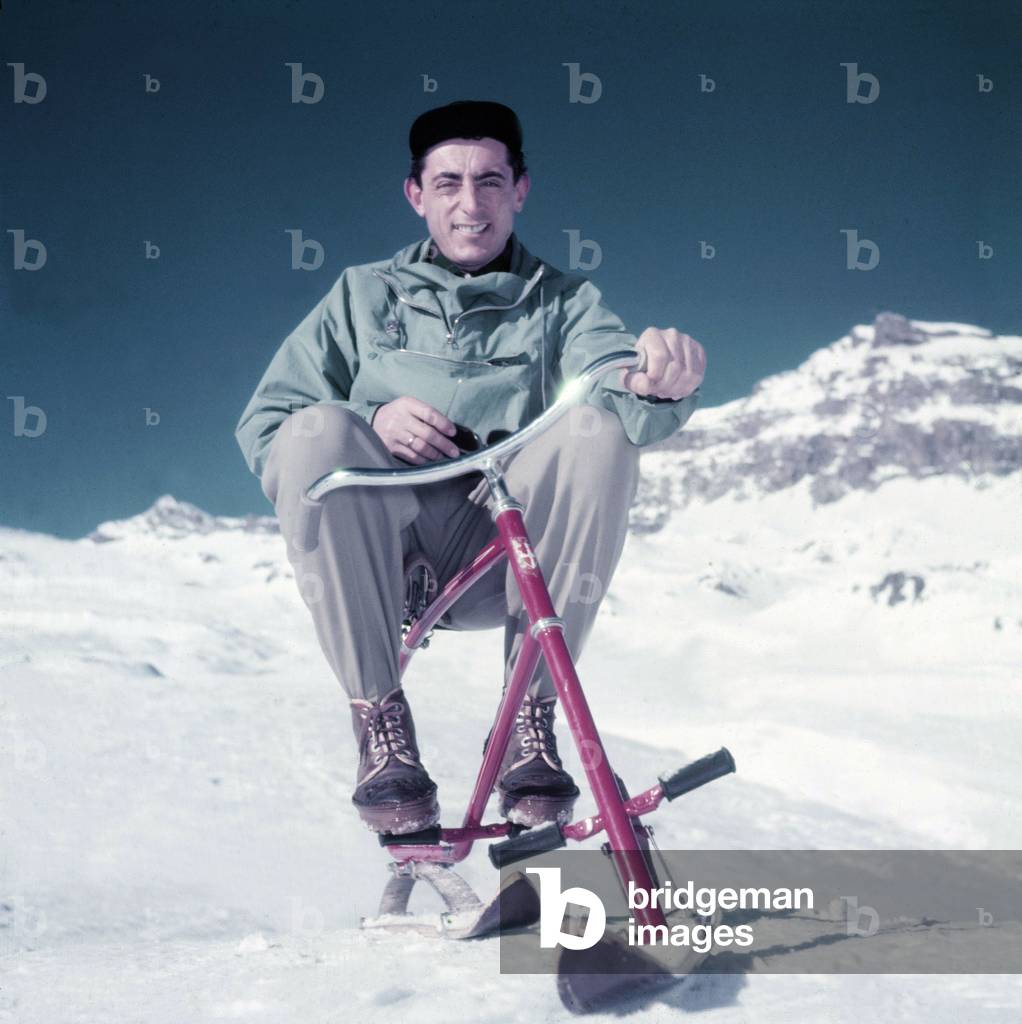Fausto Coppi on winter sports holiday on a ski bike, Cervinia, Italy, 1950s (photo)