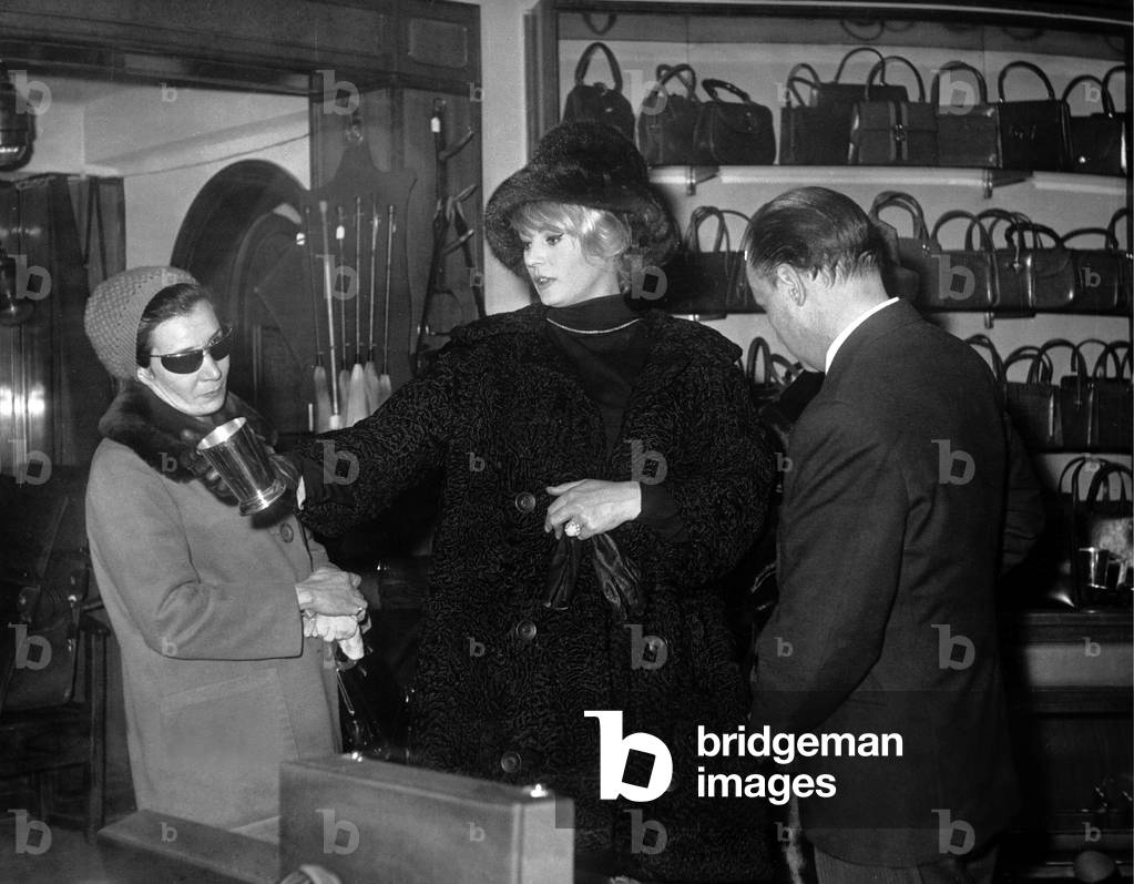 Anita Ekberg in the Gucci boutique in Via Condotti, Rome, 1964 (b/w photo)