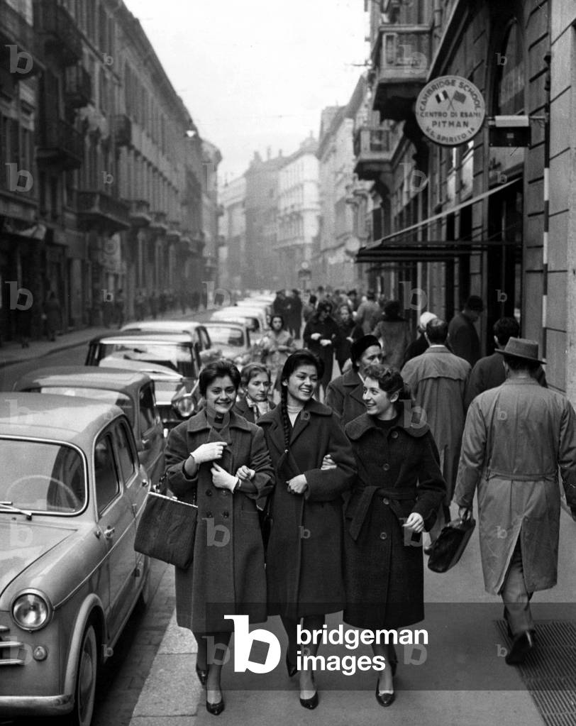 Three young seamstresses walking down Montenapoleone Street, Milan, 1959 (b/w photo)