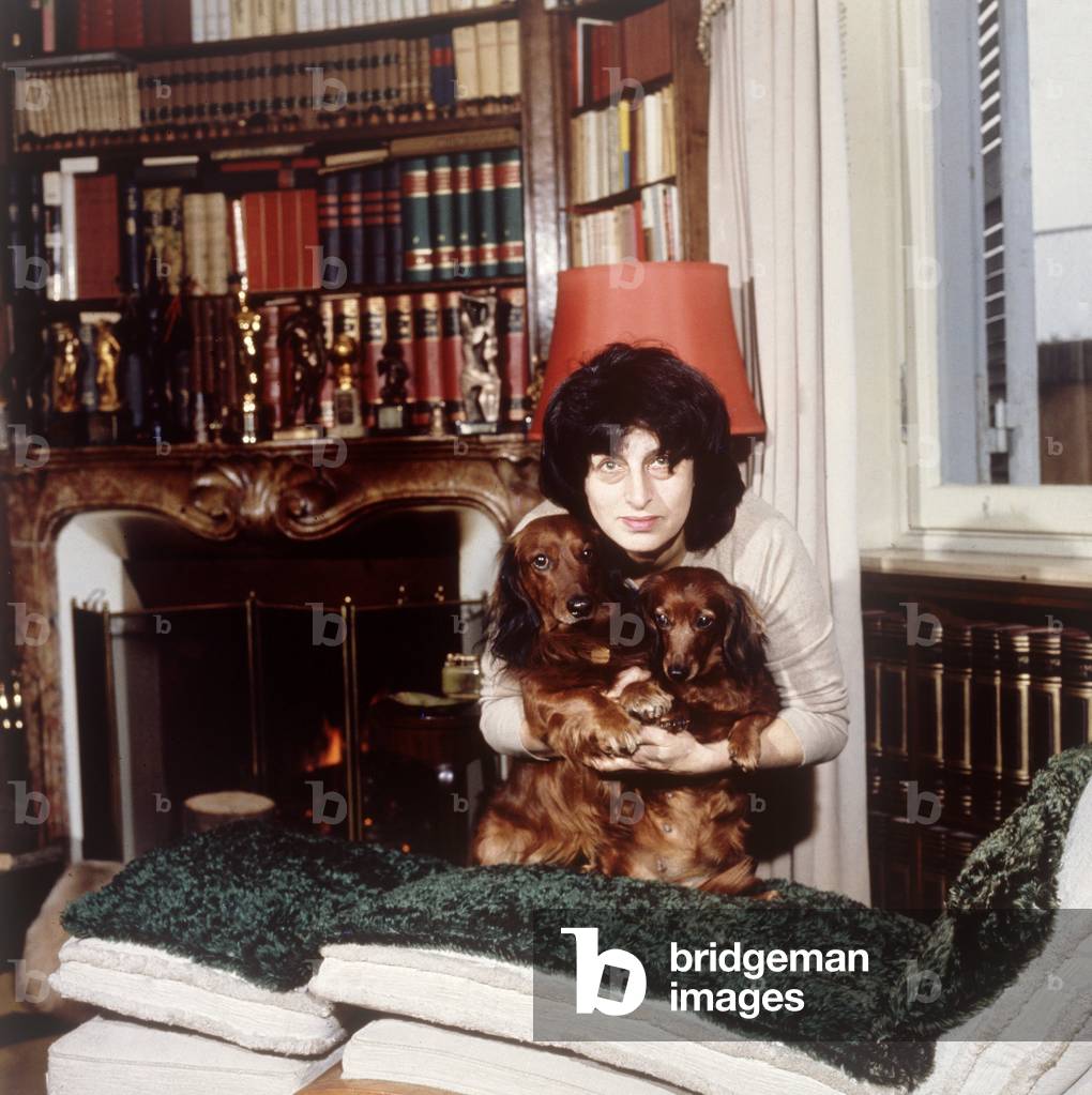 Anna Magnani at home posing with her two dogs, Rome, 1960s (photo)