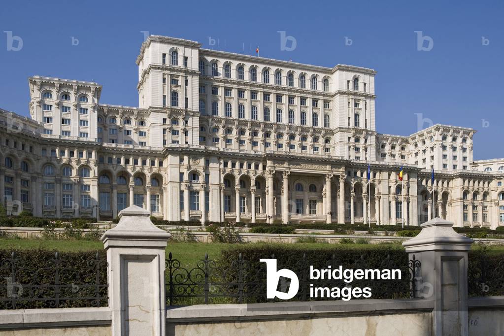 The Palace of Parliament (1984) (formerly the House of the People) in Bucharest, Romania. The House of the People and the Boulevard of the Victory of the Socialist was inaugurated by Nicolas Ceaucescu on 25 June 1984. This pharaonic project is the second largest building in the world after the Pentagon - 45,000 m2 of floor area, 400,000 m2 of living space. To build this palace, one fifth of the city was razed. The palace is now the palace of the parliament now serves as a chamber of deputes and senators. Photography 10/10/05.