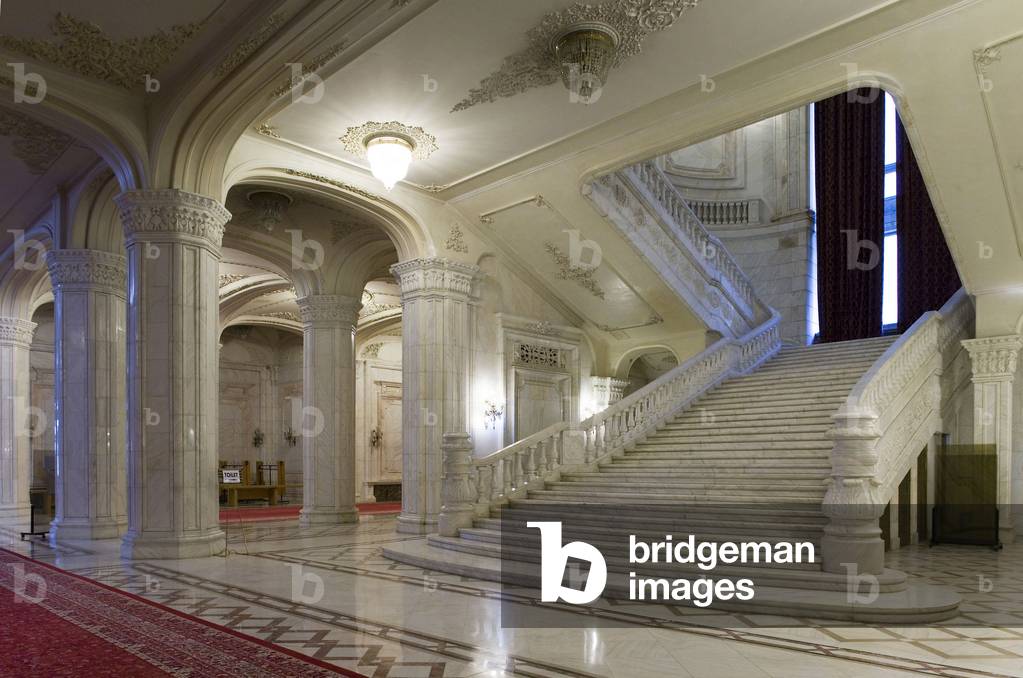 The interior of the Palace of Parliament (1984) (formerly the House of the People) in Bucharest, Romania. The House of the People and the Boulevard of the Victory of the Socialist was inaugurated by Nicolas Ceaucescu on 25 June 1984. This pharaonic project is the second largest building in the world after the Pentagon - 45,000 m2 of floor area, 400,000 m2 of living space. To build this palace, one fifth of the city was razed. The palace is now the palace of the parliament now serves as a chamber of deputes and senators. Photography 10/10/05.