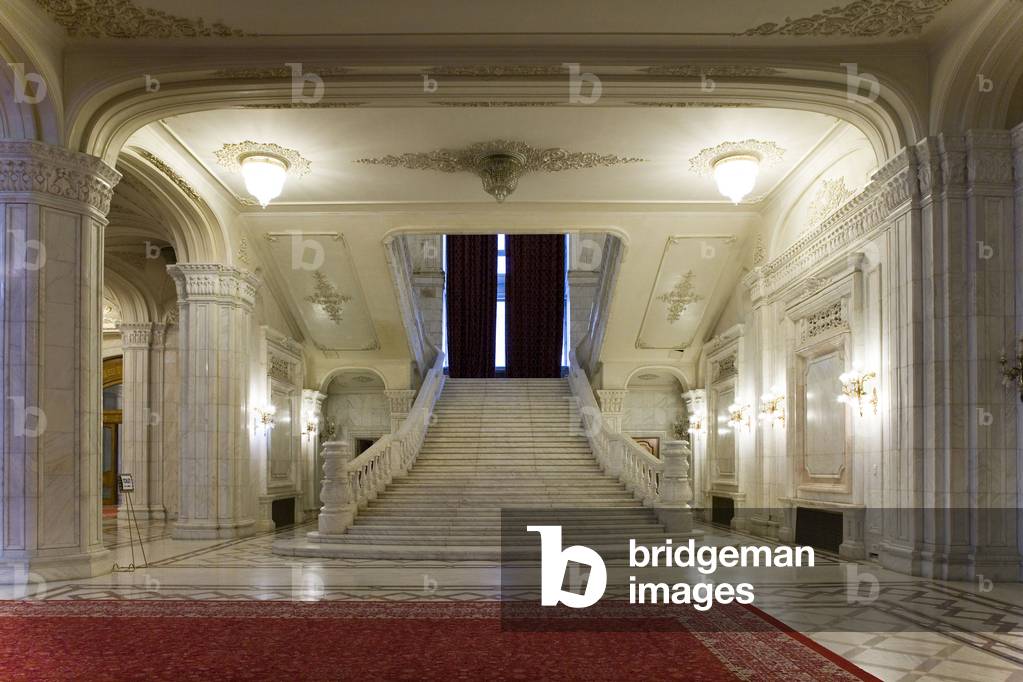 The interior of the Palace of Parliament (1984) (formerly the House of the People) in Bucharest, Romania. The House of the People and the Boulevard of the Victory of the Socialist was inaugurated by Nicolas Ceaucescu on 25 June 1984. This pharaonic project is the second largest building in the world after the Pentagon - 45,000 m2 of floor area, 400,000 m2 of living space. To build this palace, one fifth of the city was razed. The palace is now the palace of the parliament now serves as a chamber of deputes and senators. Photography 10/10/05.