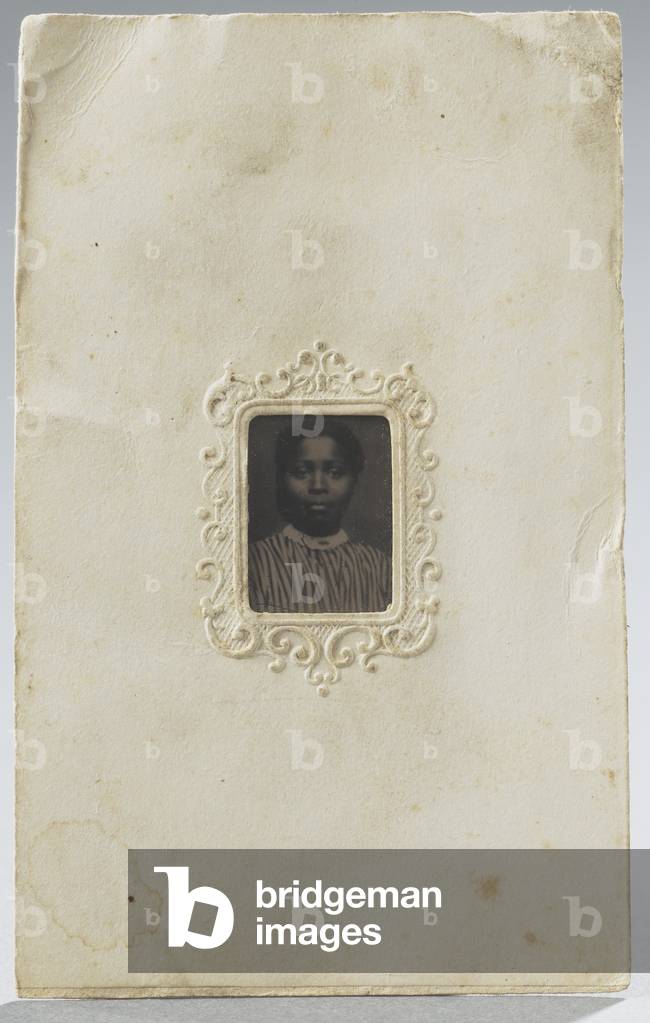 Portrait of African-American woman in striped blouse, c.1875 (tintype, in carte-de-visite decorative mat)