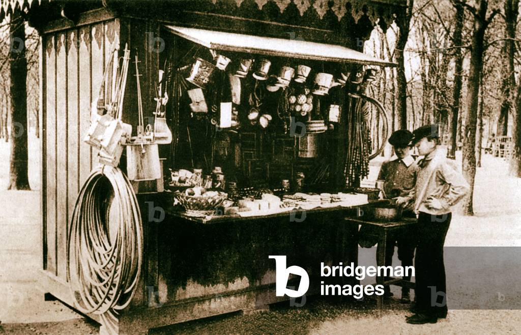 Kiosk selling games and sweets, Paris, 1905 (b/w photo)