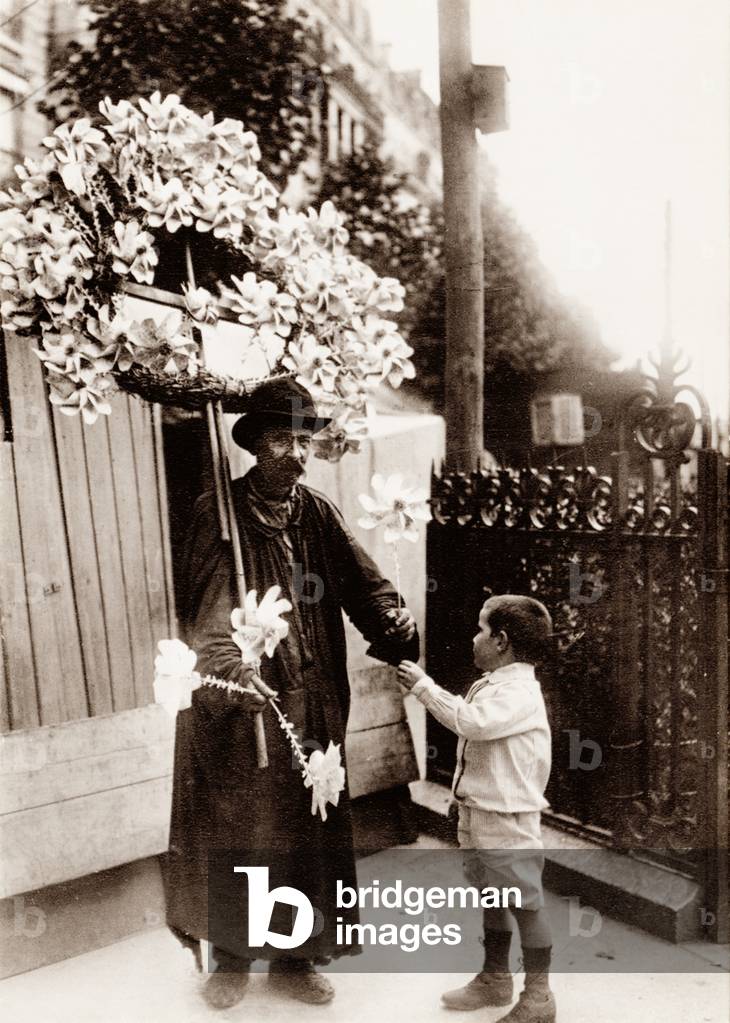 Windmill seller, Paris, 1900 (b/w photo)