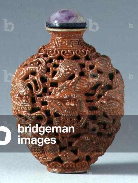 Snuff bottle, with cut-away decoration of orange-coloured dragons, Chinese, 17th-19th century (hard stone with amethyst stopper)