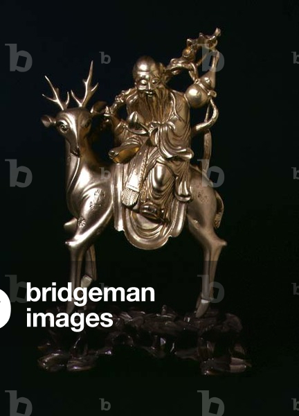 Seated figure of Shou Xing, on a stag, Fuzho, Fujian, Qing dynasty, 19th century (gilt lacquer)