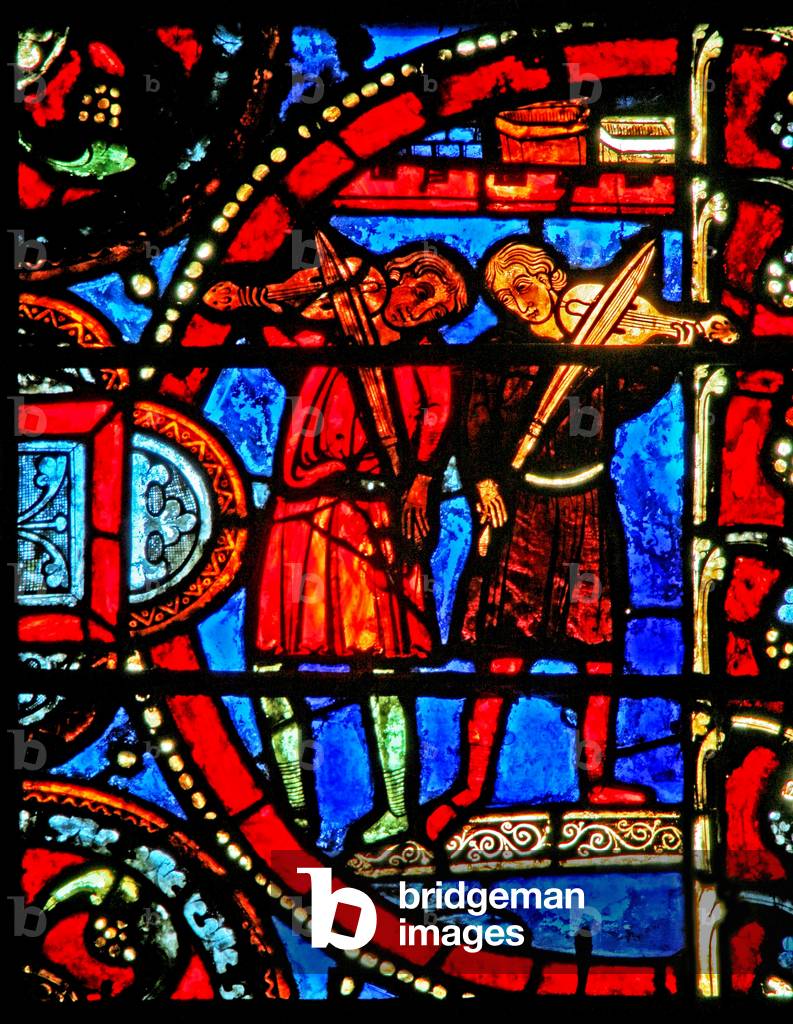 Window w12 depicting a scene from the Prodigal Son story: the musicians practise before the feast of the son's return (stained glass)