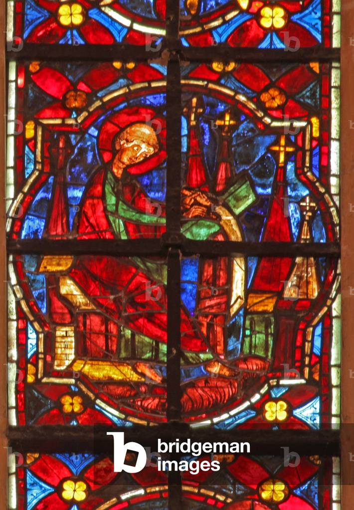Window w212 depicting St John writes the Book of the Apocalypse (stained glass)