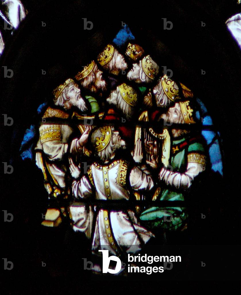 The west rose window depicting a scene from the Book of Revelation: Some of the twenty four elders with musical instruments (4:4 10). (stained glass)