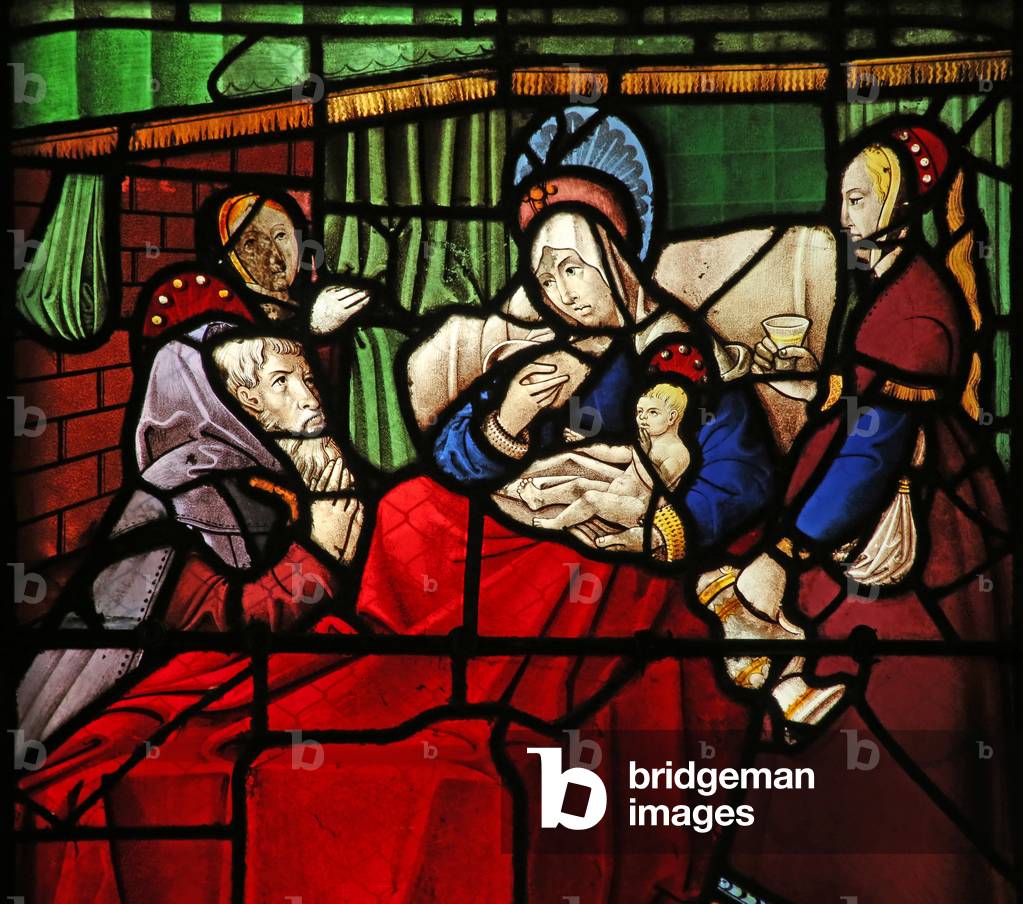 Window w17 depicting the Life of St Remi. the saint-hermit Montan is miraculously healed by the milk applied by the saint to his eyes (stained glass)