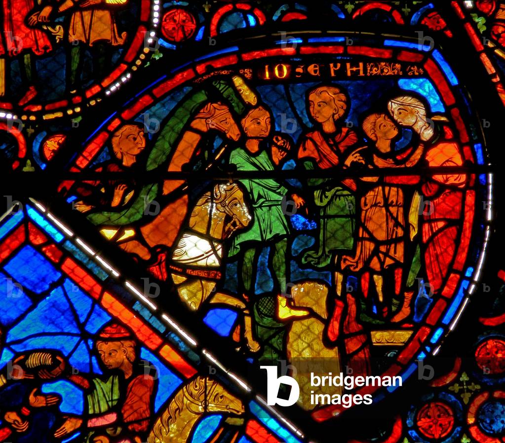 Window w24 depicting a scene from the story of Joseph: his brothers arrive and Joseph embraces Benjamin (stained glass)
