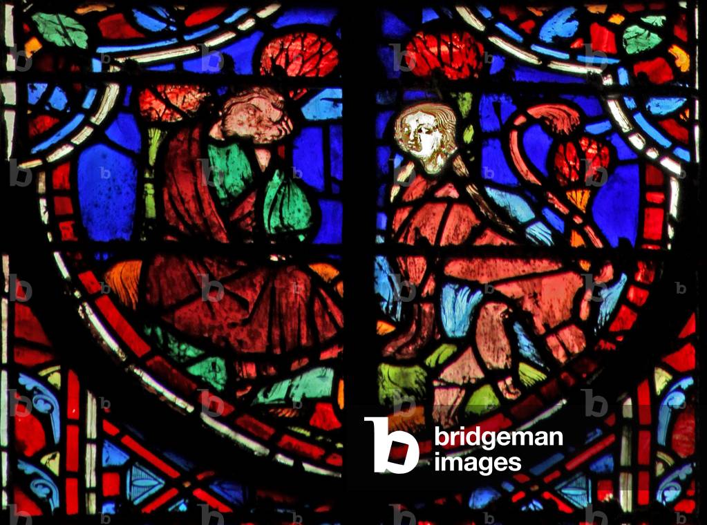 Window w11  Jeremiah sees a jackal - with female head feeding its young. Lam IV 3 (stained glass)