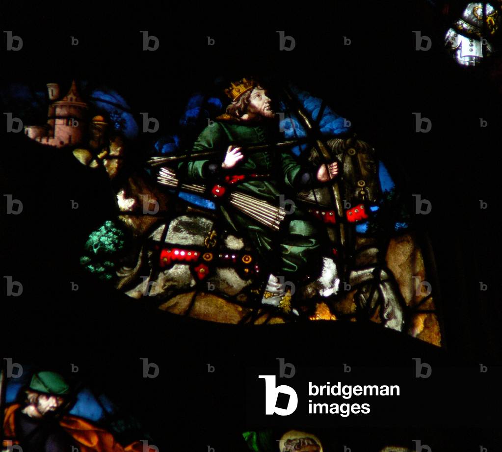 The west rose window depicting a scene from the Book of Revelation: A man on a white horse with a bow, arrows and a crown (6:2). (stained glass)