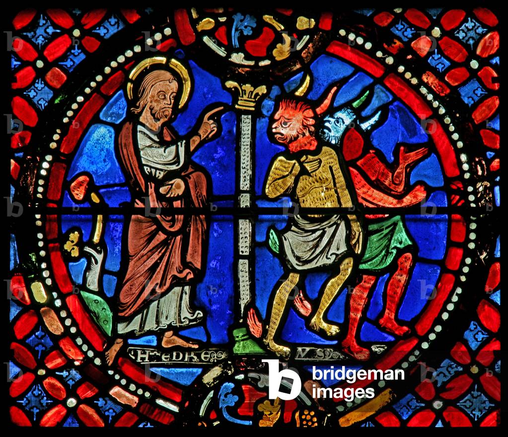 Window w9 depicting St Andrew chasing two demons (stained glass)