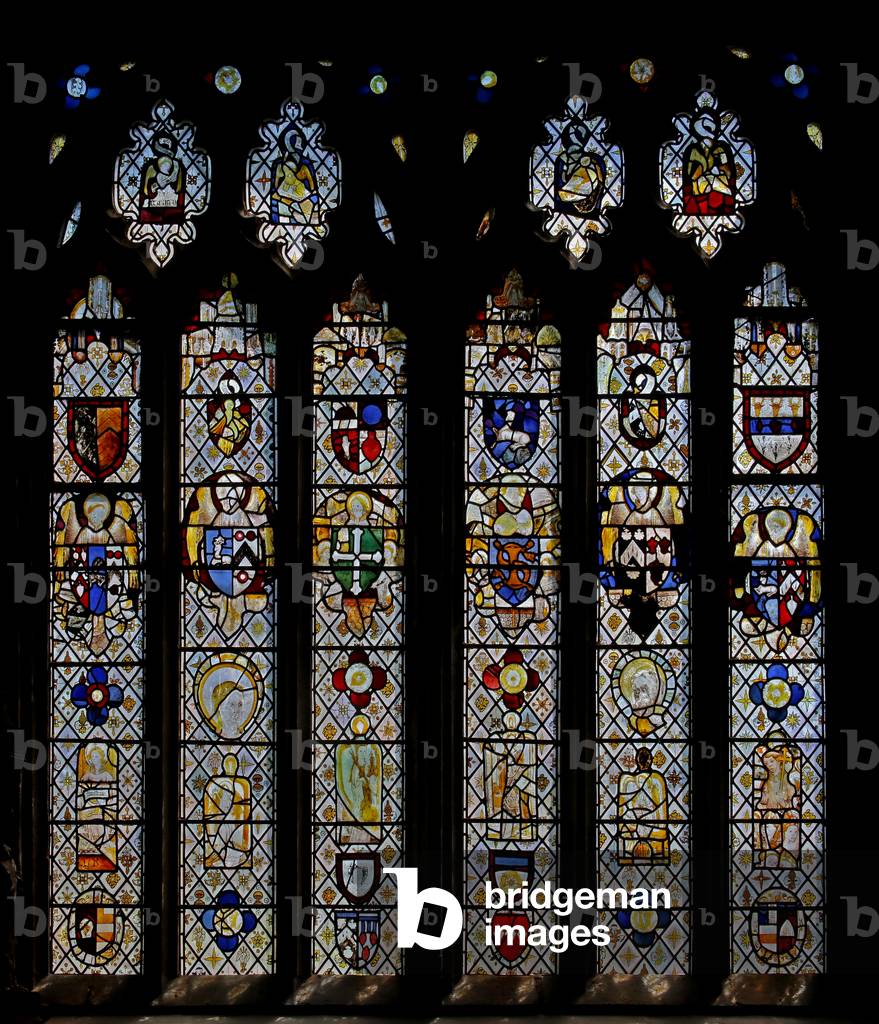 Window St Nectan Chapel Sw depicting angels with shields of arms; reset angels, heads and roundels. the four Evangelists' symbols (stained glass)