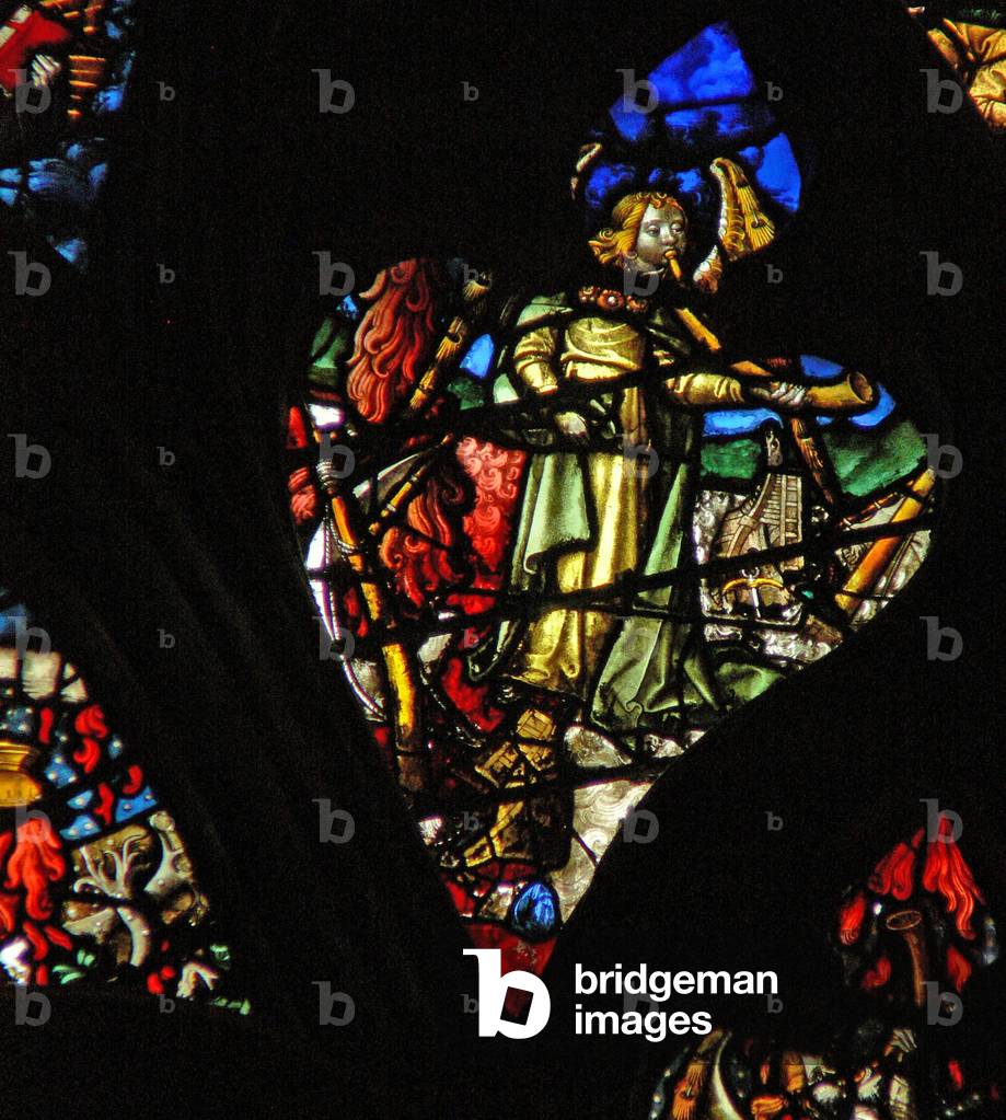 The west rose window depicting a scene from the Book of Revelation: second trumpet; a burning mountain descends into the sea (8:8 9). (stained glass)