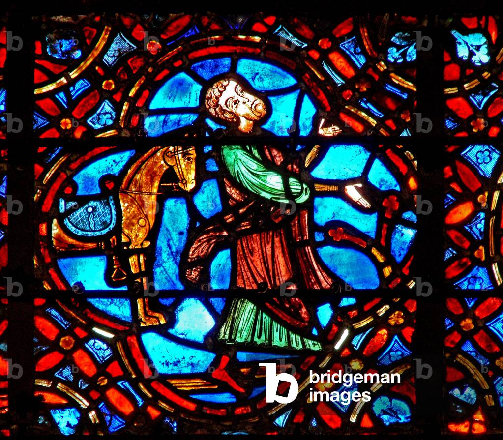 Window w12 depicting a scene in the Good Samaritan window: the Samaritan gets off his horse (stained glass)