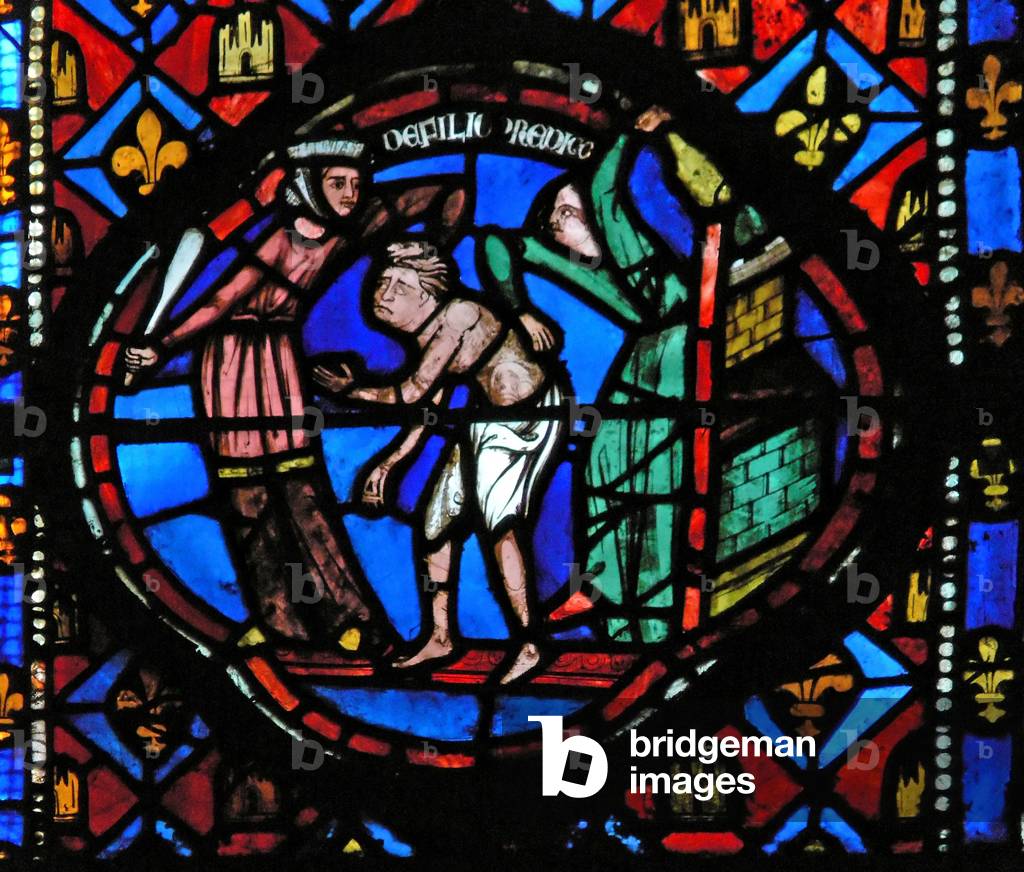 Window Ew-L depicting a scene from the Prodigal Son story: he is thrown out by the coutesans (stained glass)
