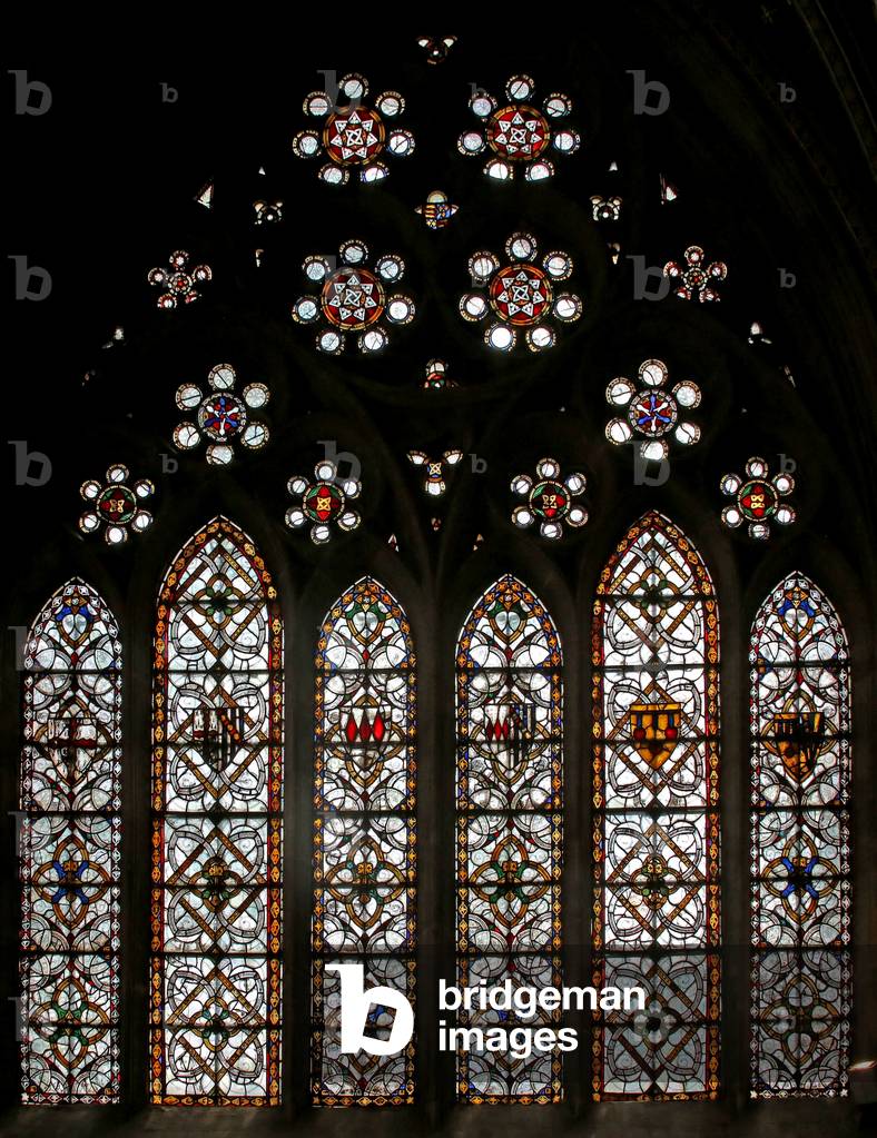 Window s5 depicting geometric grisaille and roundels in the tracery lights (stained glass)