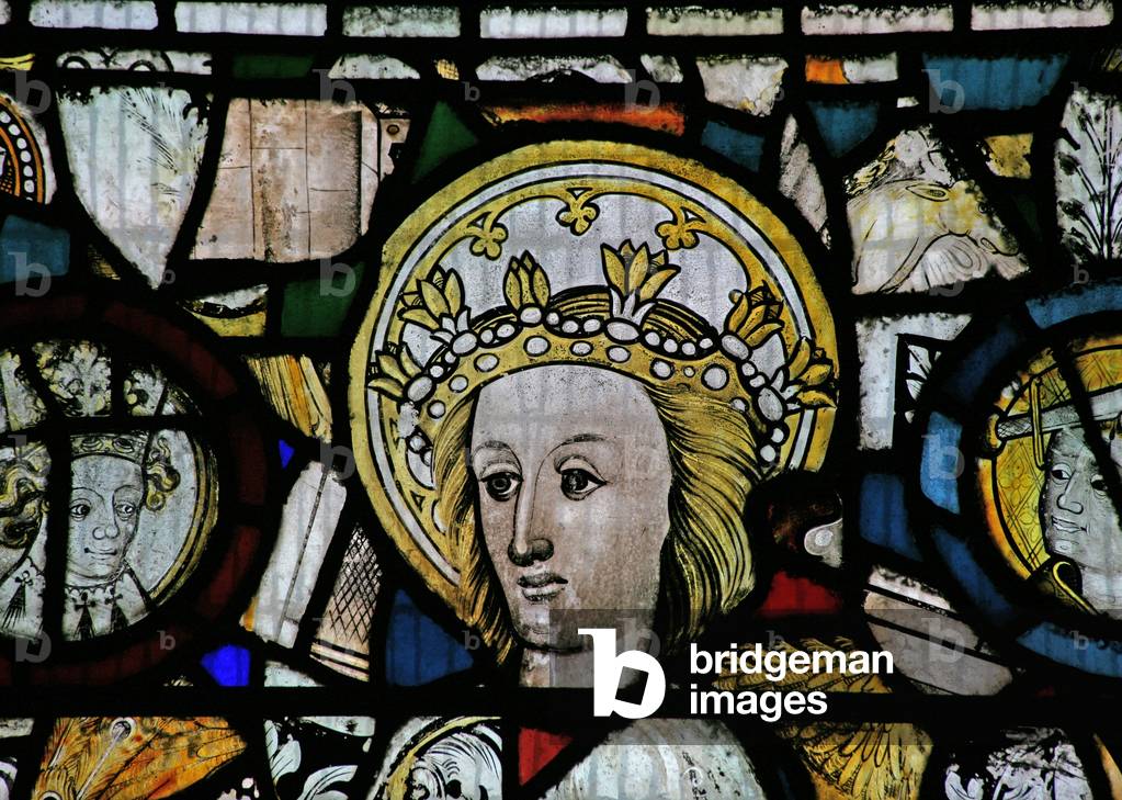 Window NW depicting a female head, crowned and sainted (stained glass)