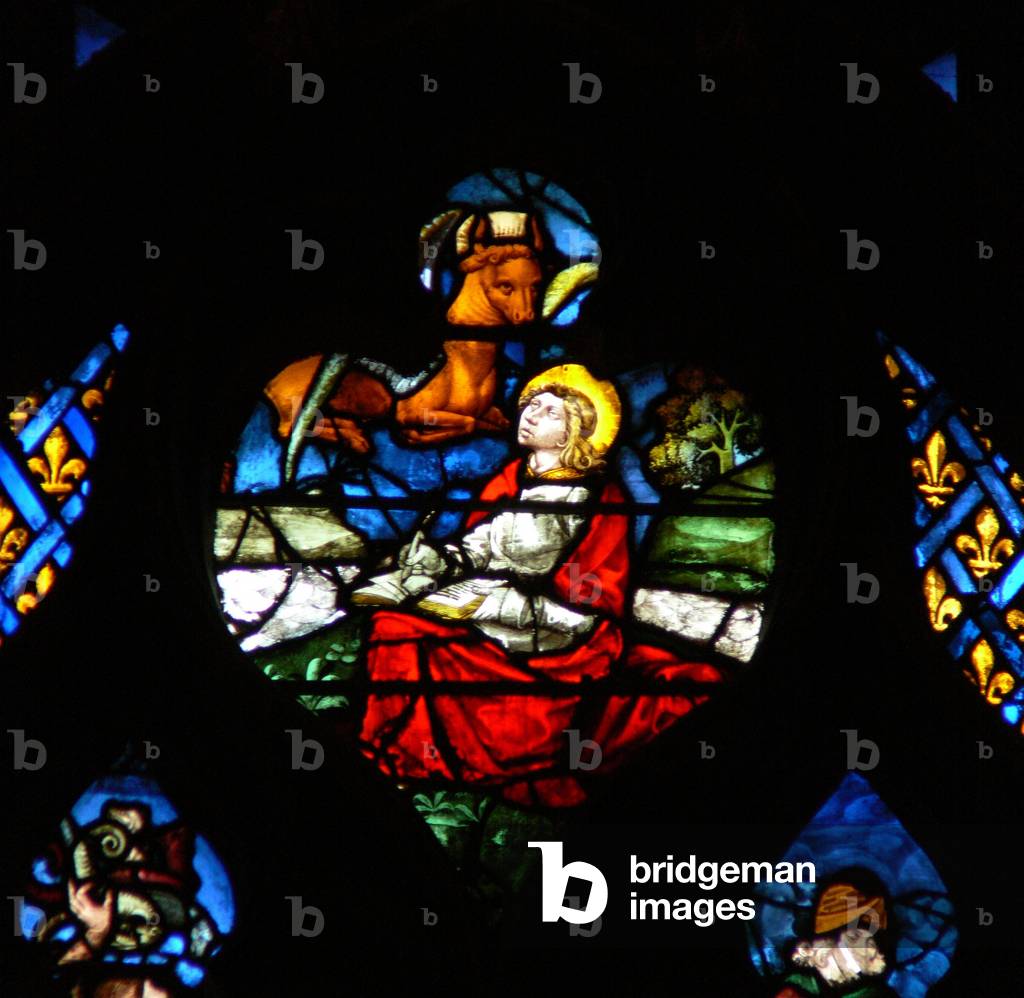The west rose window depicting a scene from the Book of Revelation: Opening of the third seal, with the bull of St Luke (6:5) (stained glass)
