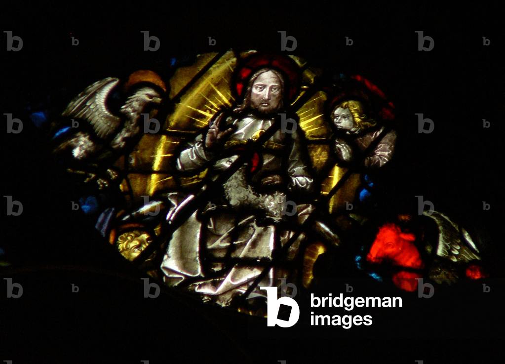 The west rose window depicting a scene from the Book of Revelation: lamb before the throne, between the four sacred living creatures (7:9 12). (stained glass)
