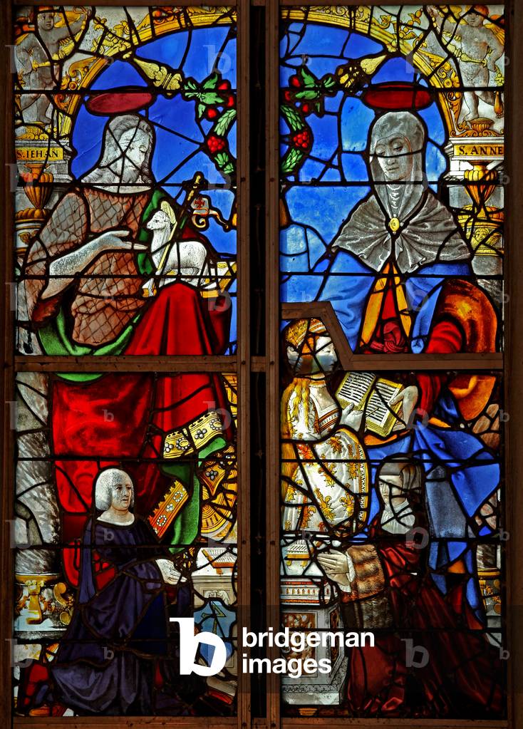 Window w8 depicting donors with St John the Baptist; also St Anne teaching the Virgin Mary to read (stained glass)