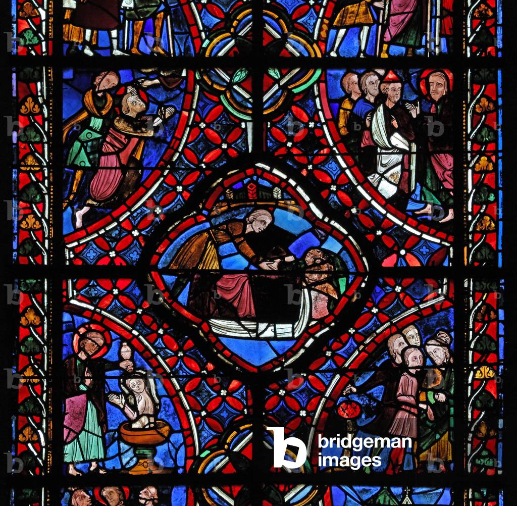 Window depicting the third section of the St James window, w5: not all of the scenes have been identified, but a baptism can be seen and possibly the martyrdom of the saint (stained glass)