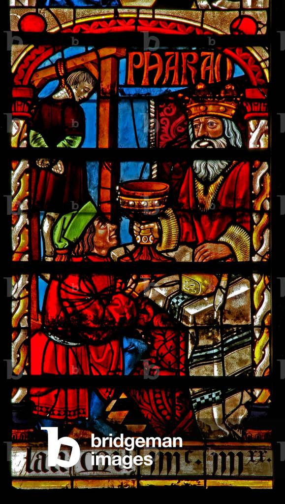 Window w234 depicting a scene from the story of Joseph: the butler reinstated and baker is hung (stained glass)