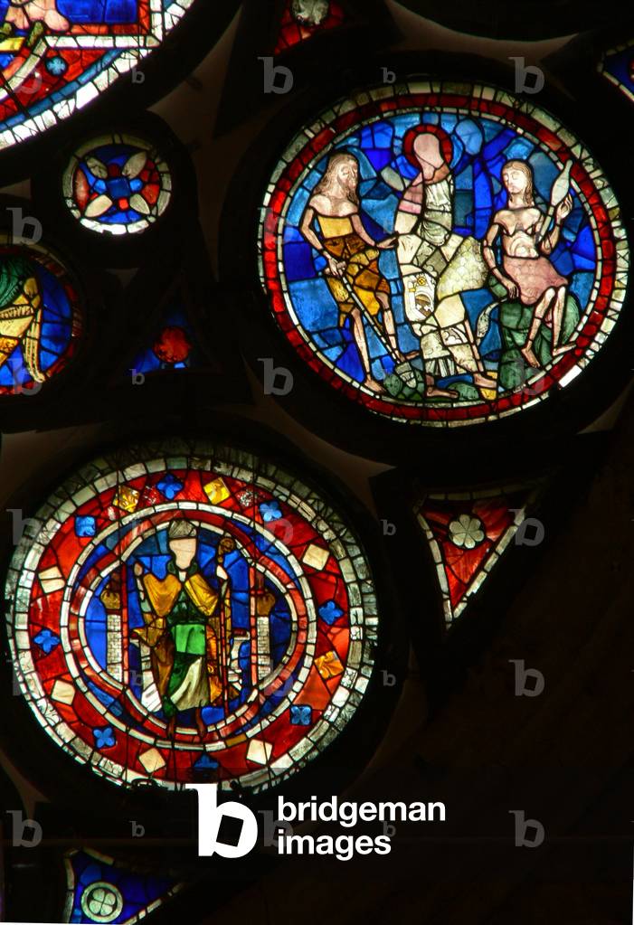 Window N rose depicting Adam and Eve; a bishop (stained glass)