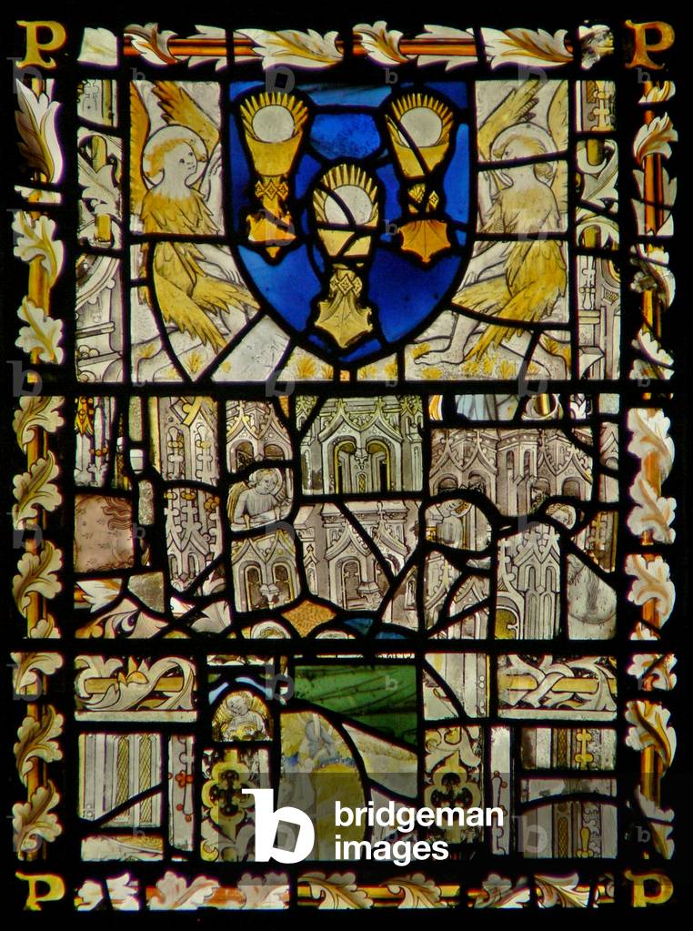 The east window depicting a shield with emblems of the Sacrament; fragments of canopy with figures (stained glass)